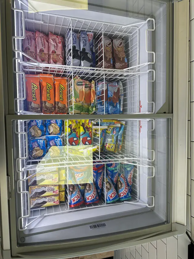 Upright freezer packed with novelty ice cream bars at Joe's Ice Cream warehouse